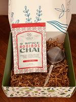 Premium chai starter gift box with loose leaf chai blend and stainless steel chai strainer for authentic tea brewing